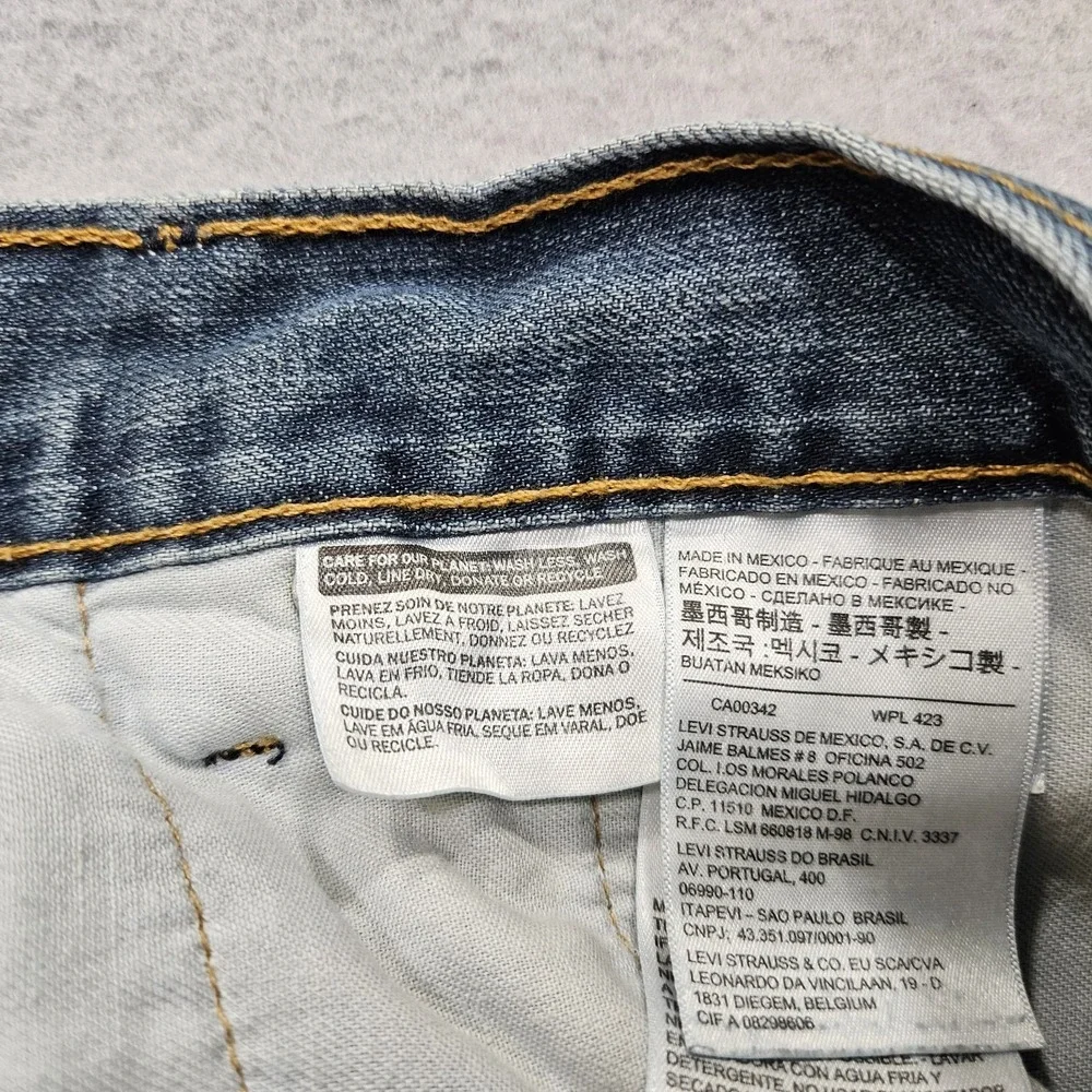Levis 559 Relaxed Straight Jeans Mens 50x31 Blue Medium Wash Trucker Damaged